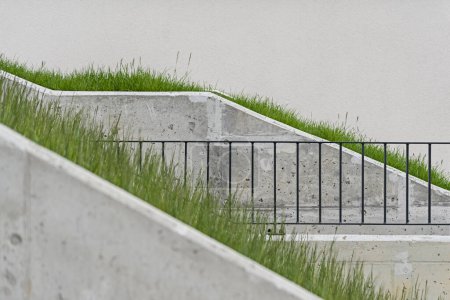 Detail on walkways made of concrete in a modern multifamily building in a European city.
