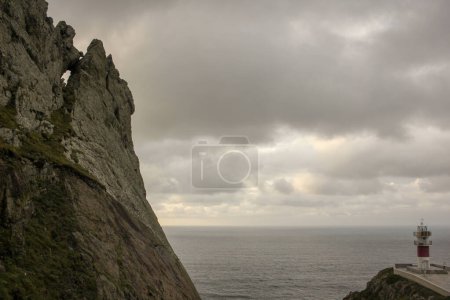 Photo for Rocks and lighthouse in Cape Ortegal in the Atlantic Ocean - Royalty Free Image