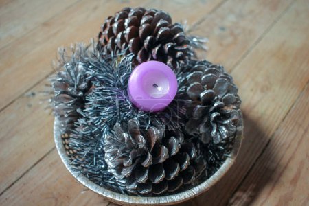 pines and a candle for decoration