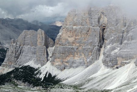 Landscape photo of Lagazuoi mountains covered in thick fog in Dolomites, South Tyrol region, Italy