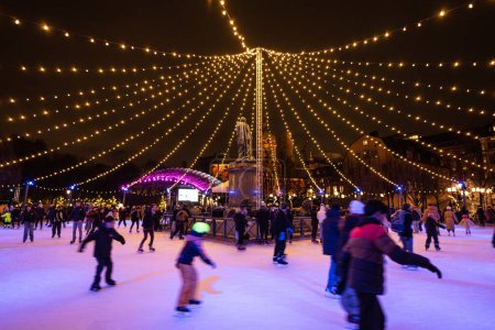 Photo for Stockholm, Sweden - December 10, 2022: Kungstrdgrden public ice skating with Christmas decoration - Royalty Free Image