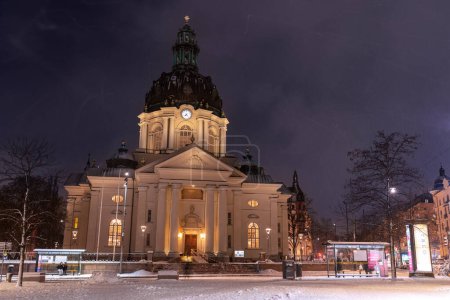 Photo for Stockholm, Sweden - January 06, 2023: Gustaf Vasa Church (Odenplan) on winter evening during snowfall - Royalty Free Image