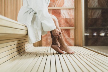 Photo for Woman Relaxing in Salt Room. Sitting in Bathrobe and Enjoying . - Royalty Free Image