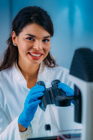 Photo for Biology Student Researcher Looking Through the Microscope - Royalty Free Image