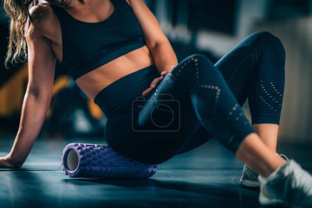 Photo for Using Foam Roller for Muscle and Fascia Stretching and Conditioning - Royalty Free Image
