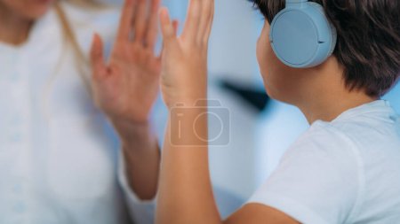 Photo for Hearing Test for Children. Early detecting hearing problems which can affect speech and language development. Audiologist Working with a Preschooler Boy - Royalty Free Image