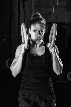 Photo for Cross training. Gymnastic rings exercising - Royalty Free Image