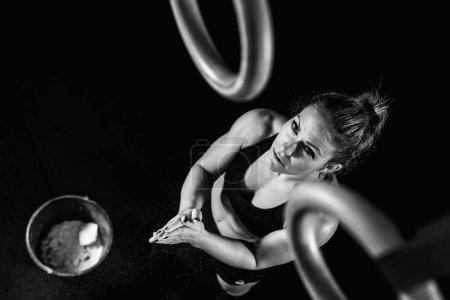 Photo for Cross training. Gymnastic rings exercising - Royalty Free Image