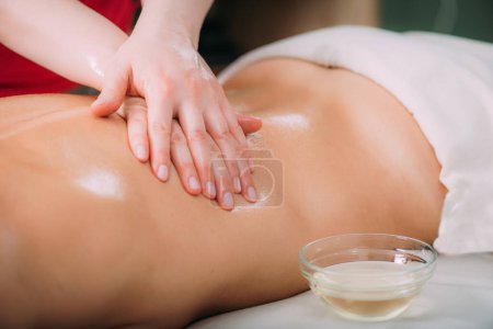 Photo for Massage for stress and tension relief. Female massage therapist massaging a woman - Royalty Free Image