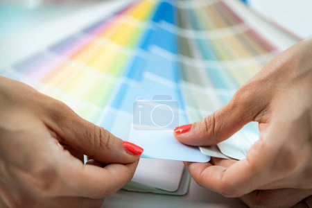 Photo for Interior designer choosing colors from color palette for walls. - Royalty Free Image