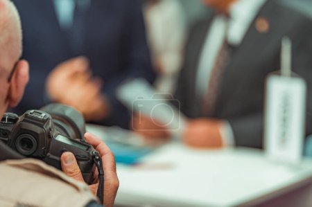 Photo for Trade show event with media cameras capturing the attention of industry professionals and enthusiasts. - Royalty Free Image