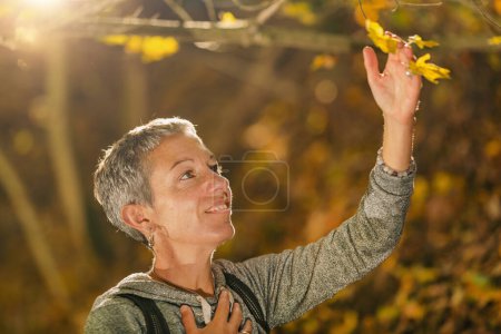 Photo for Mindful middle-aged woman appreciating the nature - Royalty Free Image