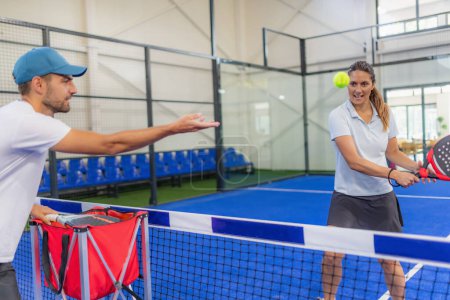 Photo for Elevate skills with focused indoor Padel training. Expert coaching, effective techniques - Royalty Free Image