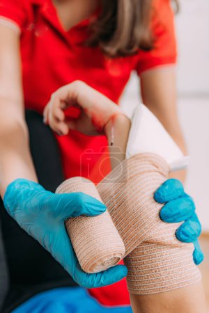 Photo for Arm cut First Aid course. Treating arm cuts effectively in informative first aid course. - Royalty Free Image