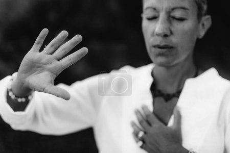 Photo for Spiritual Coach Sending Positive Thoughts Hand Gesture - Royalty Free Image