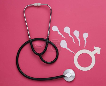 Foto de Salud sexual masculina. Análisis de las causas de infertilidad. Estetoscopio con semen masculino (espermatozoides) y símbolo de género masculino sobre fondo rosa - Imagen libre de derechos