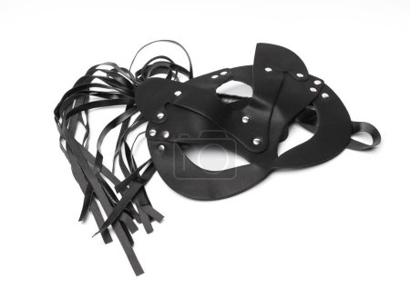 Photo for Leather whip with mask from sex shop on white background. Sex games - Royalty Free Image