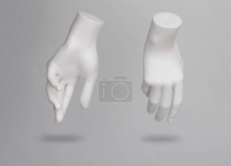 White mannequin hands levitating on gray background with shadow
