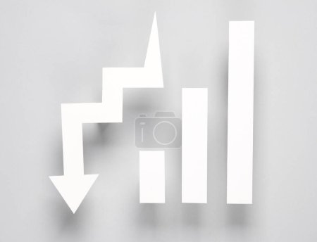 Photo for Paper-cut columns of a chart tending upwards and drop arrow on gray background. Economic, analytics, business concept - Royalty Free Image