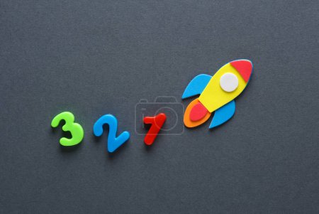 Photo for Rocket with a countdown on a gray background - Royalty Free Image