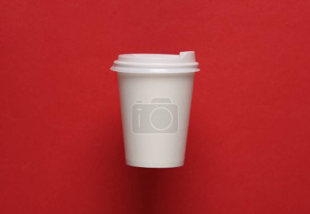Photo for Mockup of white disposable cup with lids for hot drinks on red background - Royalty Free Image