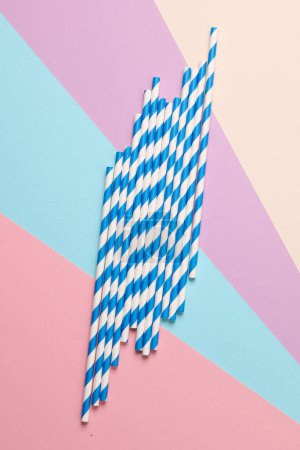 Photo for Blue paper straws on pastel background. Party, birthday accessories - Royalty Free Image