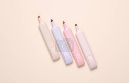 Photo for Markers or colored felt-tip pens on beige pastel background. Creative layout - Royalty Free Image
