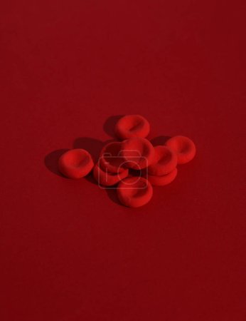 Photo for Red blood cells model on red background - Royalty Free Image