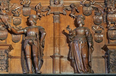 Photo for Bruges, Belgium - July 19, 2020:  Wooden sculpture of the Emperor family in the Alderman Hall,of the Justice palace - Royalty Free Image