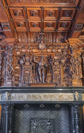 Photo for Bruges, Belgium - July 19, 2020:  Wooden sculpture of the Emperor family in the Alderman Hall, of the Justice palace - Royalty Free Image