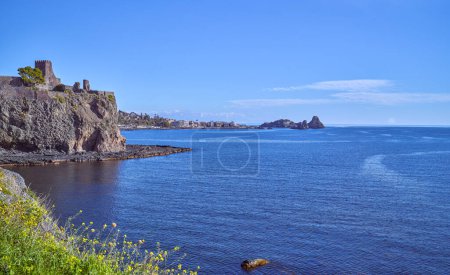 Photo for Italy, Aci Castello, panoramic view of the coast with the stacks of the Cyclops marine reserve in the background - Royalty Free Image