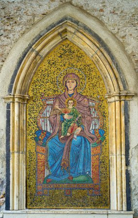 Photo for Taormina, Italy - February 5, 2023: A mosaic depicting the Madonna with child under the the Clock Tower Gate - Royalty Free Image