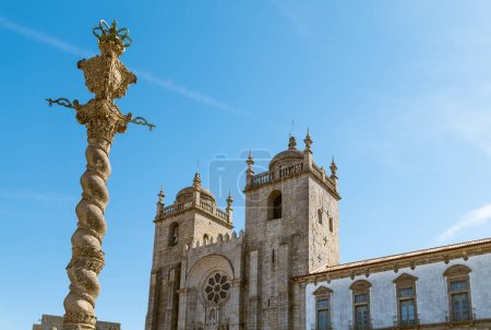 Photo for Porto, Portugal, view of the facade of the Porto Cathedral (Cathedral of Assumption of our Lady) with the Pillory column in the foreground - Royalty Free Image