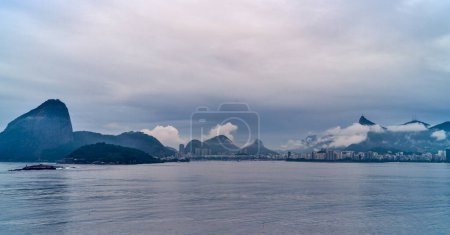 Photo for Brazil, Rio De Janeiro, panorama of the famous bay of Rio seen from the sea at the first light of dawn - Royalty Free Image