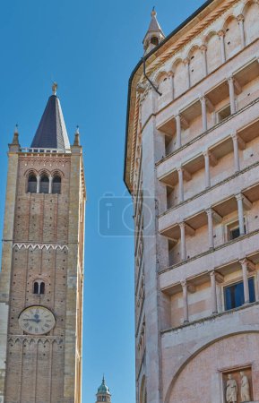 Photo for Parma, Italy, the Cathedral bell tower and the octagonal Baptistery of pink marble in Lombard Romanesque style - Royalty Free Image