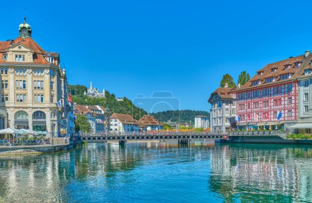 Photo for Lucerne, Switzerland - July 13, 2022:  View of the houses of the old town on the Reuss River Banks - Royalty Free Image