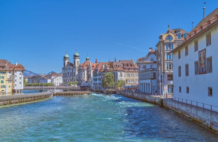 Photo for Lucerne, Switzerland - July 13, 2022:  View of the houses of the old town on the Reuss River Banks - Royalty Free Image