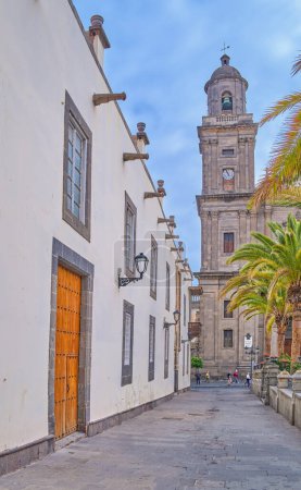 Photo for Las Palmas, Gran Canaria , Spain  - March 17, 2023: View of the Santa Ana Cathedral bell tower with the Episcopal palace on the left - Royalty Free Image