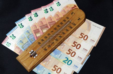 Cuadro de símbolos Aumento de los costes de calefacción: termómetro con billetes en euros