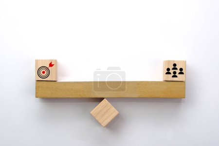 Photo for People icon and target on wooden seesaw. Concept of the balance in teamwork, collaboration and cooperation. - Royalty Free Image