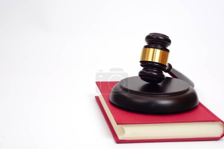 Selective focus, judge gavel or lawyer or law or justice placed on law book on white background.