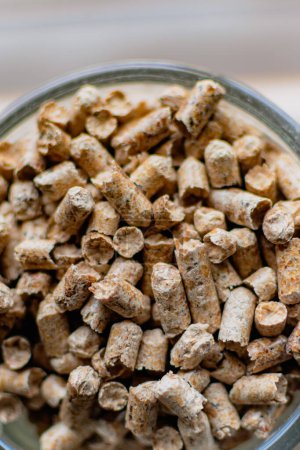 Pellet for stove or boiler in a glass, compressed wood granule