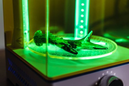 3d resin printing of a deer antler turning in a cure machine using UV light