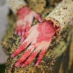 Hands decorated with henna are a hallmark of receptions in Aceh