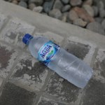 plastic bottles in a water bottle on the street