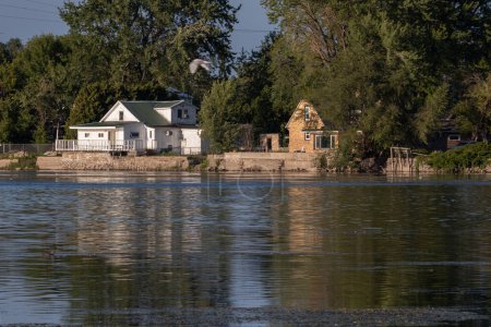 Photo for Winnebago Lake Reflections: Serene Skyline and Lakeside Houses - Royalty Free Image