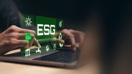 A person using laptop with esg concept 
