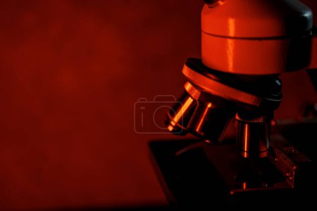 Photo for Medical microscope lenses close up, In warm red lighting - Royalty Free Image