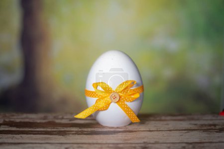 Photo for Eggs wrapped in a colorful gift tie. Easter, Pascha or Resurrection Sunday concept - Royalty Free Image