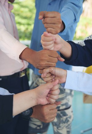 Photo for Diverse multiethnic Partners hands together teamwork group of multiracial people meeting join hands togetherness. Diversity people hands join empower partnership teams connection volunteer community - Royalty Free Image